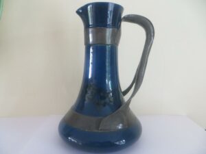 Ruskin pottery jug with strap-work by Jesson and Birkett circa 1904/5, scissor mark to base.