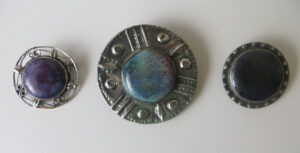 Cottage industry pewter brooches.