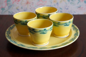 Early egg cups in a soufflé yellow glaze.