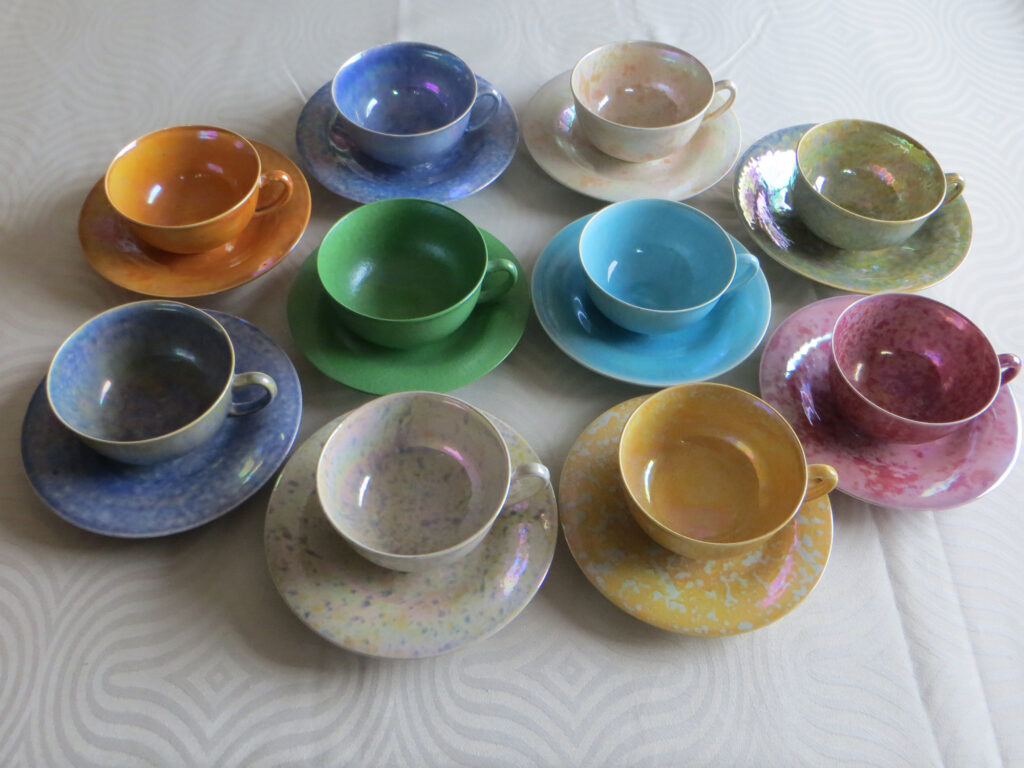 1920s Ruskin cups and saucers in the harlequin glazes.