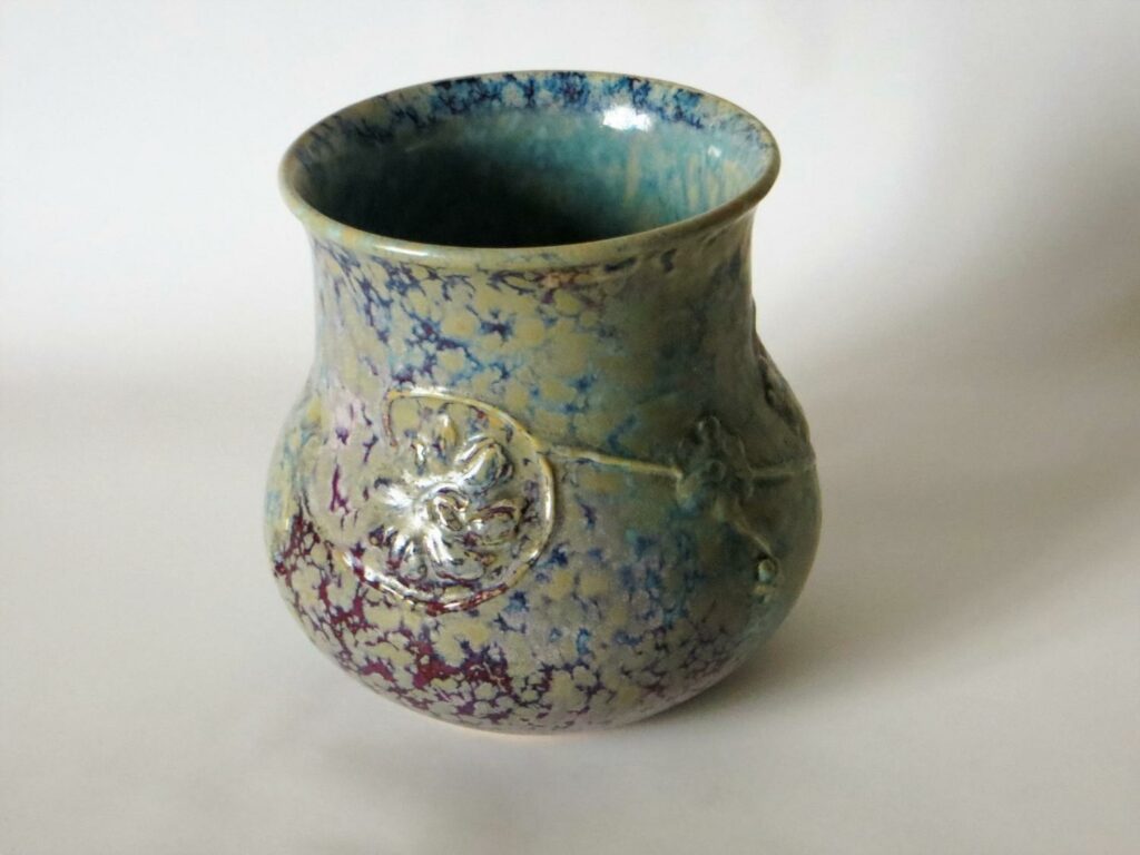1927 circa high-fired vase, with moulded decoration.