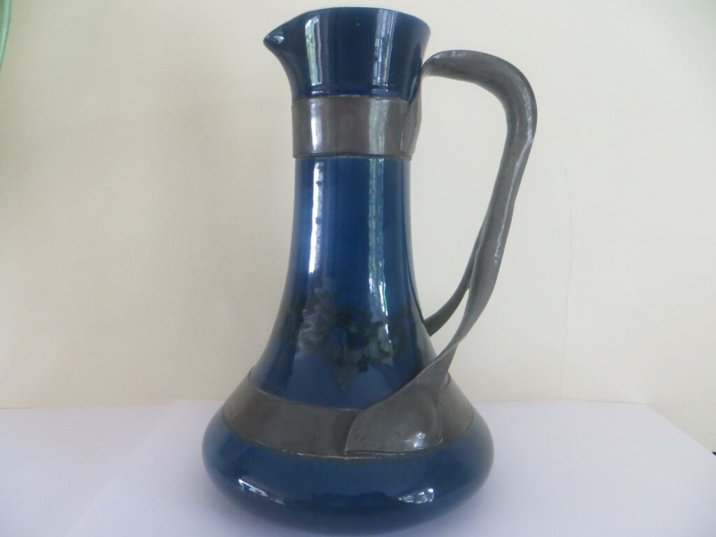 Ruskin pottery jug with strap-work by Jesson and Birkett circa 1904/5, scissor mark to base.